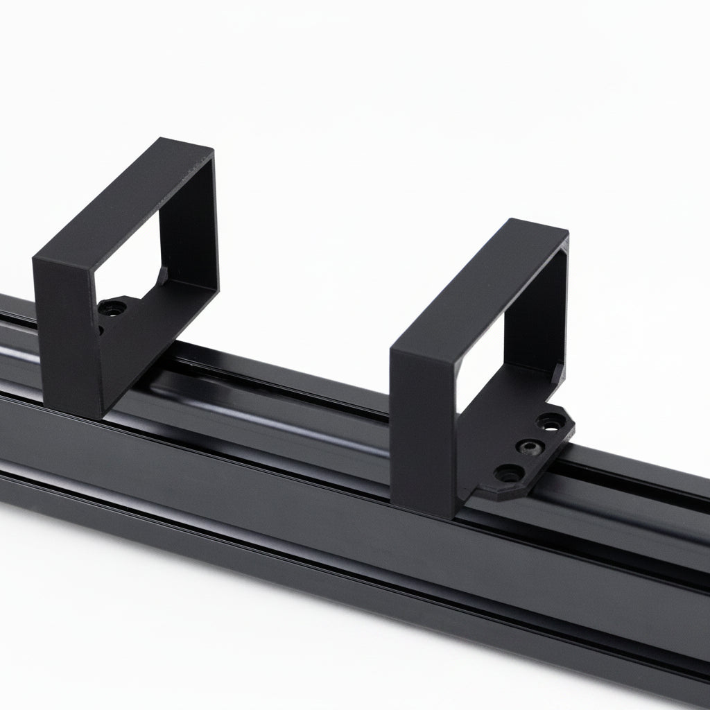 A black power brick bracket designed for a Samsung G5 monitor, mounted on a racing simulator rig.